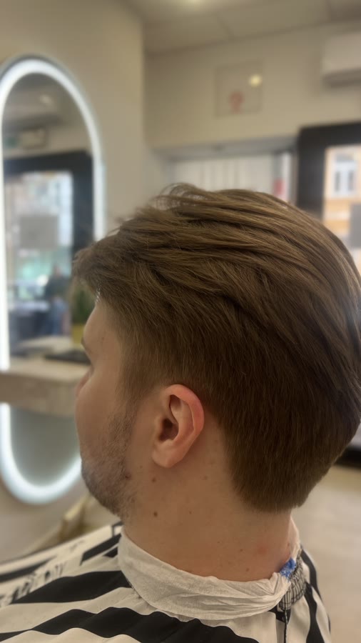 A men's fade, side view