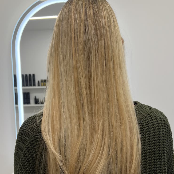 Glossy, healthy blonde hair after styling