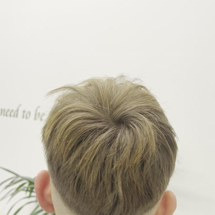 A men's fade, seen from behind