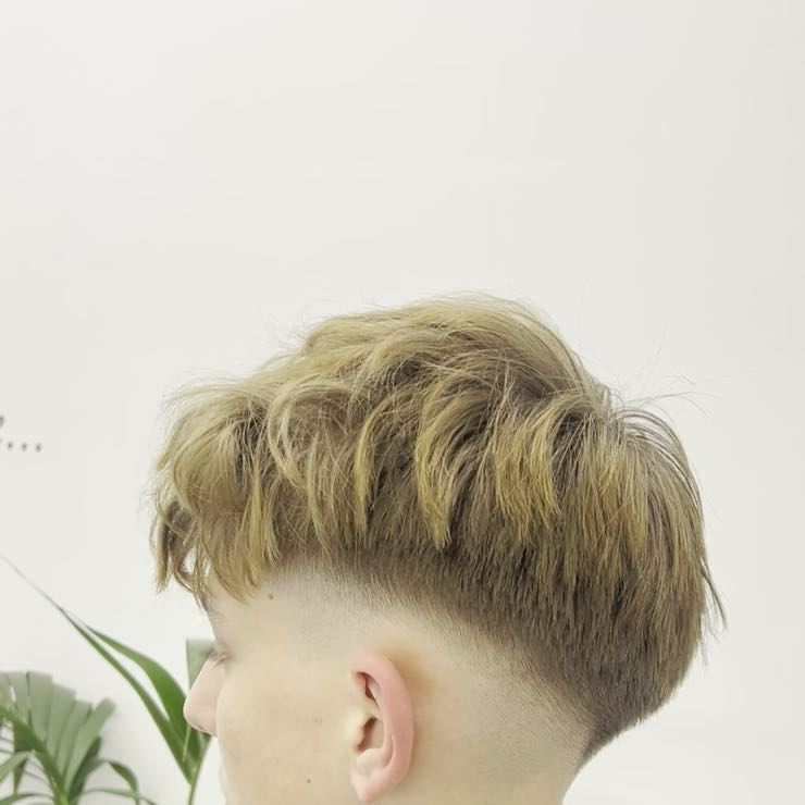 A men's fade, side view