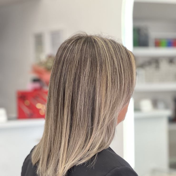 Long hair with highlights blending from brown to blonde