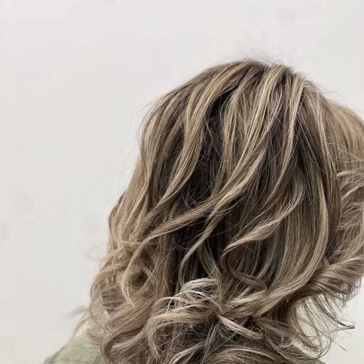 Wavy hair with light highlights
