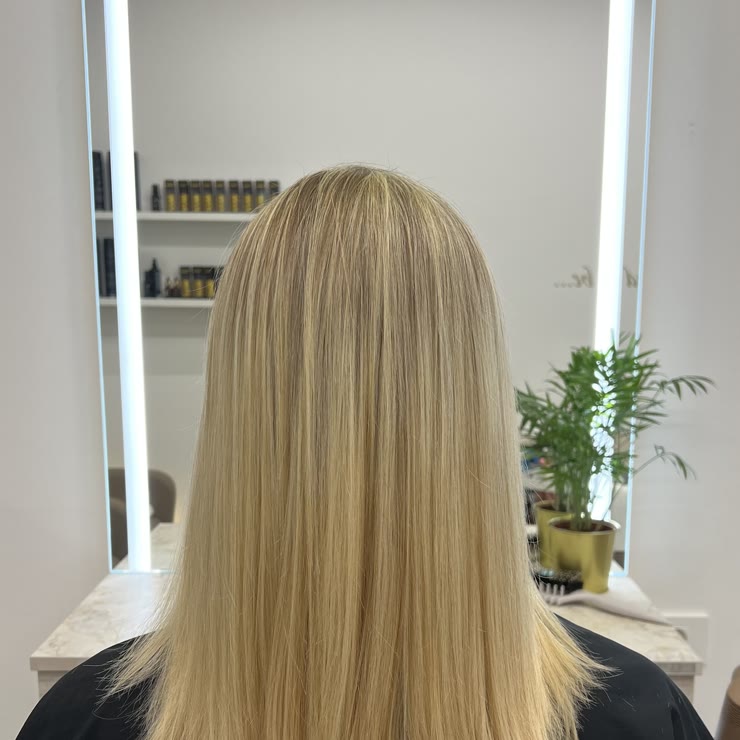 Blonde highlights on blunt-cut shoulder-length hair