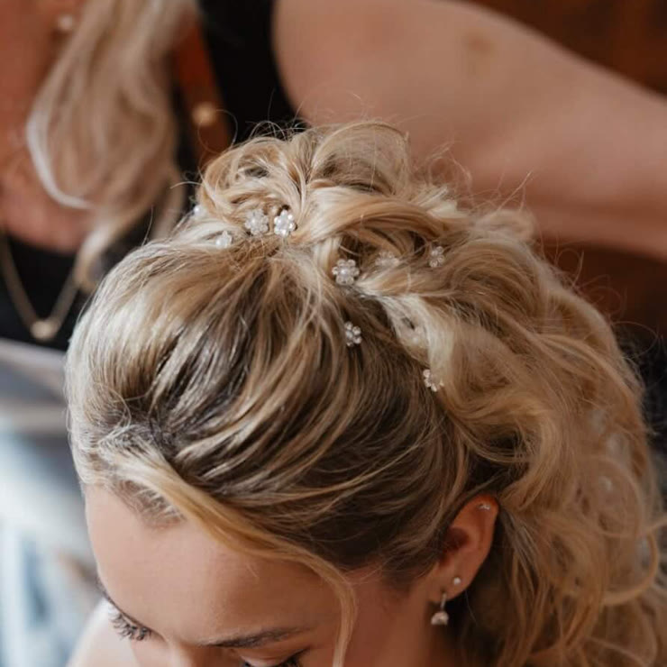 An occasion updo with small pearls, close up