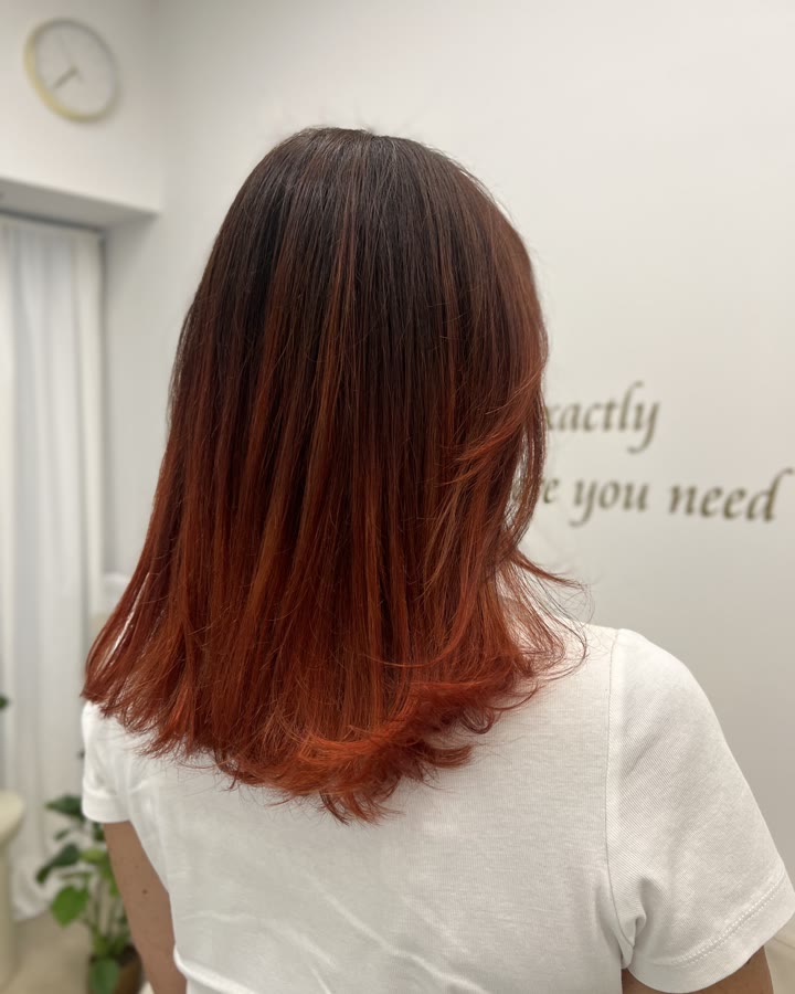 Warm copper red on shoulder-length hair, after the service