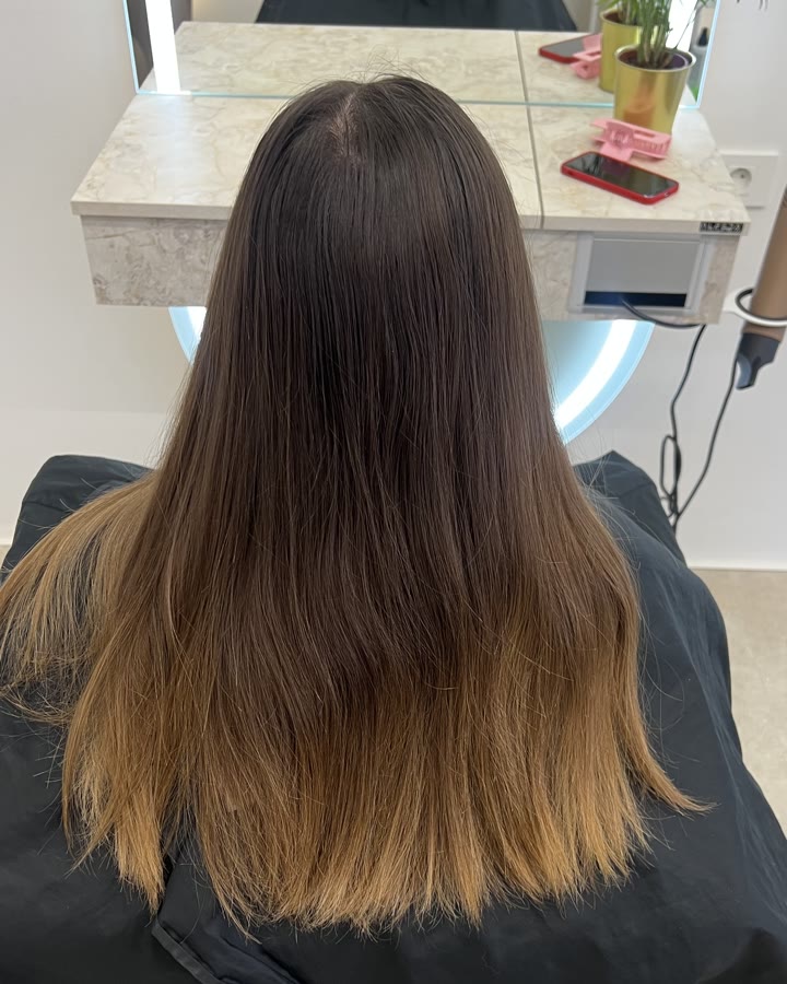 The same hair before the cut – long, with a grown-out blend